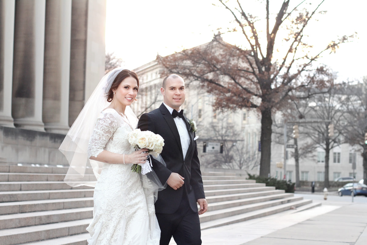 newlyweds walking together at carnegie institute in pittsburgh, pa