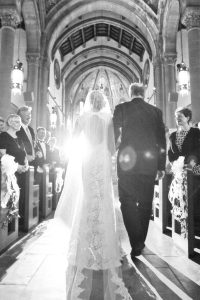 ethereal image of father walking bride down the aisle at st. bernard church in pittsburgh pa
