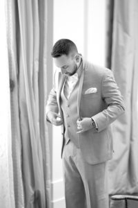 groom-putting-on-coat