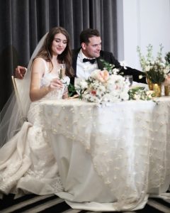 Bride and Groom at sweetheart table at their wedding reception at the Hotel Monaco in Pittsburgh, PA