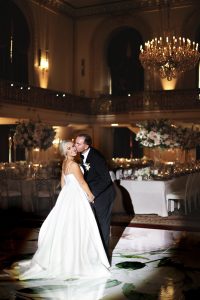 Bride and Groom in the spotlight in the Omni William Penn Hotel Grand Ballroom in Pittsburgh, PA